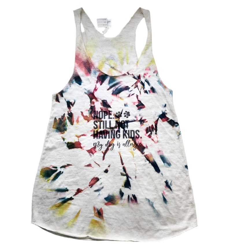 Hand-dyed multicolor small tank top with text on it laid out on a flat surface.