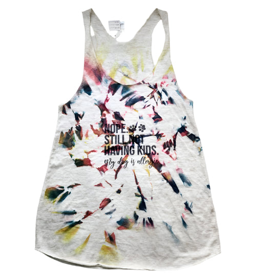 Hand-dyed multicolor small tank top with text on it laid out on a flat surface.