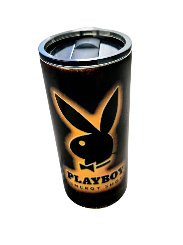 A black 22oz Playboy Bunny tumbler with a vintage-style fade and the iconic Playboy Bunny logo in gold. The tumbler is accompanied by a metal lid and is pictured with ice cubes to suggest its use for cold beverages.