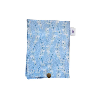 Floral patterned pouch with a button on a white background
