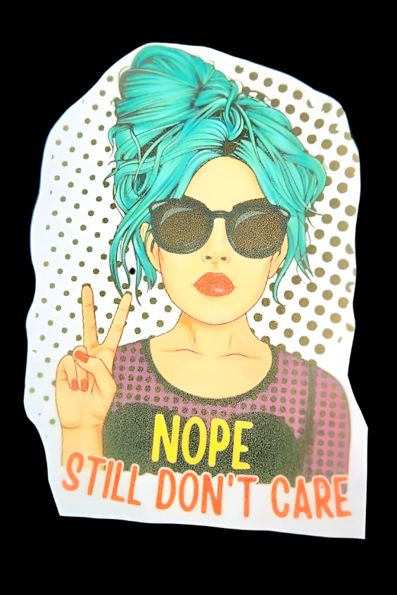 Sticker with a person with blue hair and sunglasses, making a peace sign, with 'NOPE STILL DON'T CARE' text on a polka dot background.