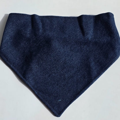 A dark navy blue woven fabric bandana or pet bandana laid flat on a light gray background.