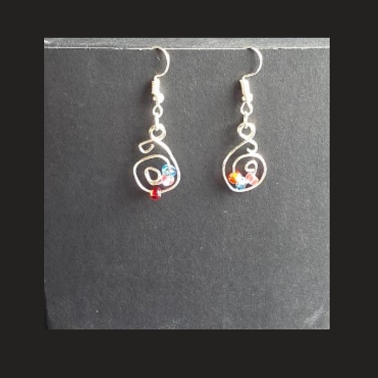 Shop handmade silver-tone spiral dangle earrings with colourful bead accents. Lightweight handcrafted earrings made in Alberta, Canada.