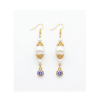 A pair of gold and white drop earrings with white pearl-like beads, ornate gold filigree, and round purple gemstone dangles, shown on a plain white background.