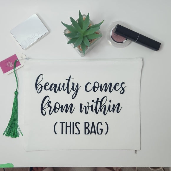 Canvas makeup bag with green tassel and printed design